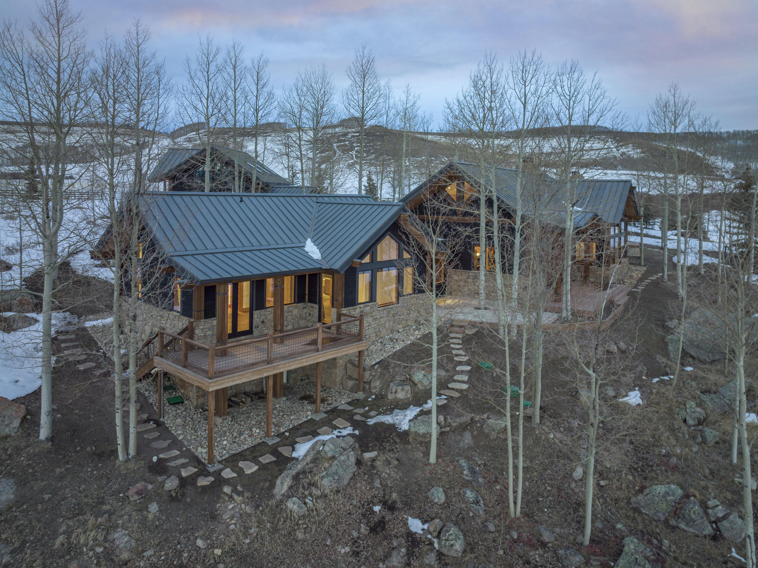 6800 County Road Telluride, CO 81435 - Photo 50 of 64 a view of a house with a yard from a lake view
