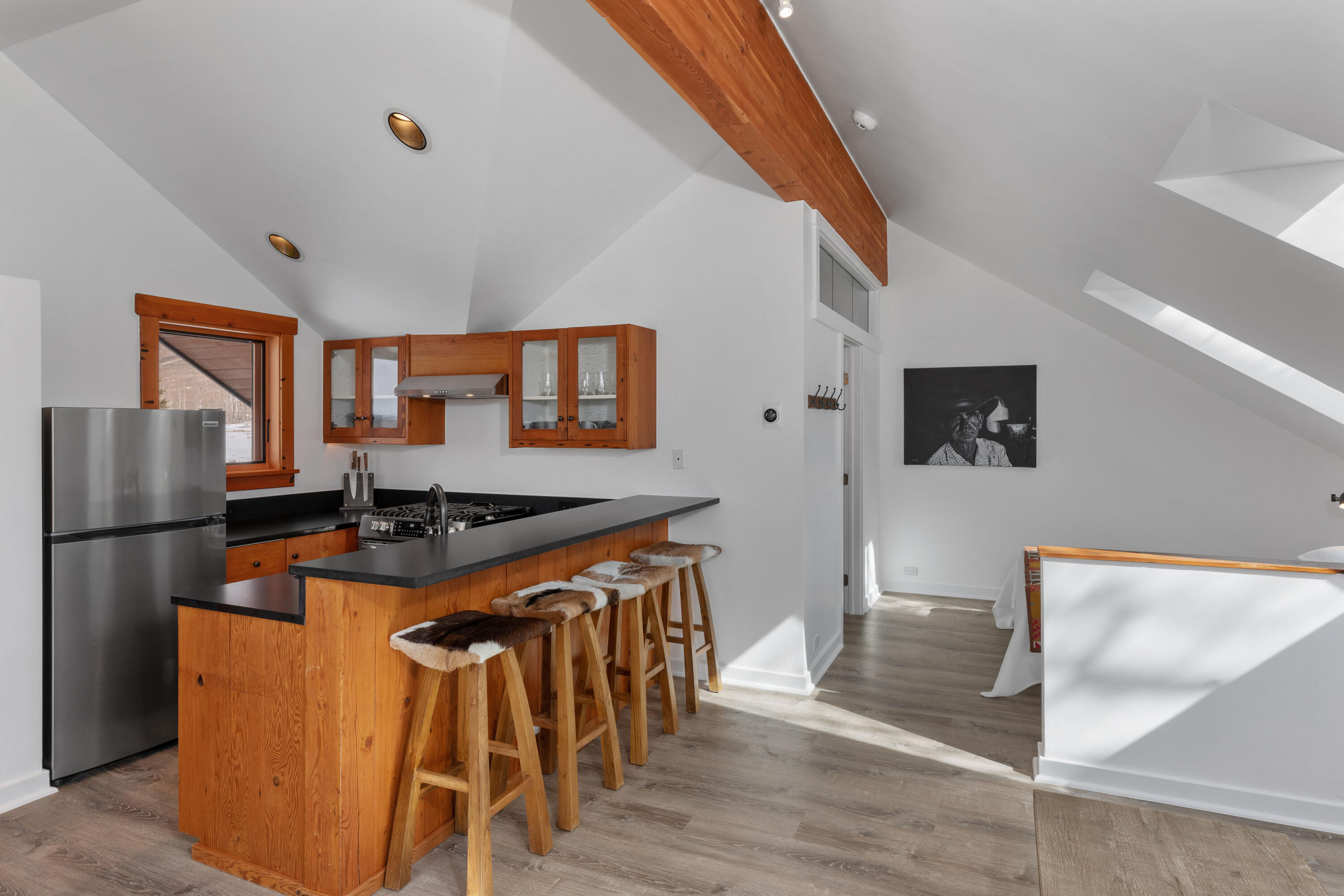6800 County Road Telluride, CO 81435 - Photo 56 of 64 a kitchen with stainless steel appliances granite countertop a refrigerator a stove a sink a dining table and chairs with wooden floor