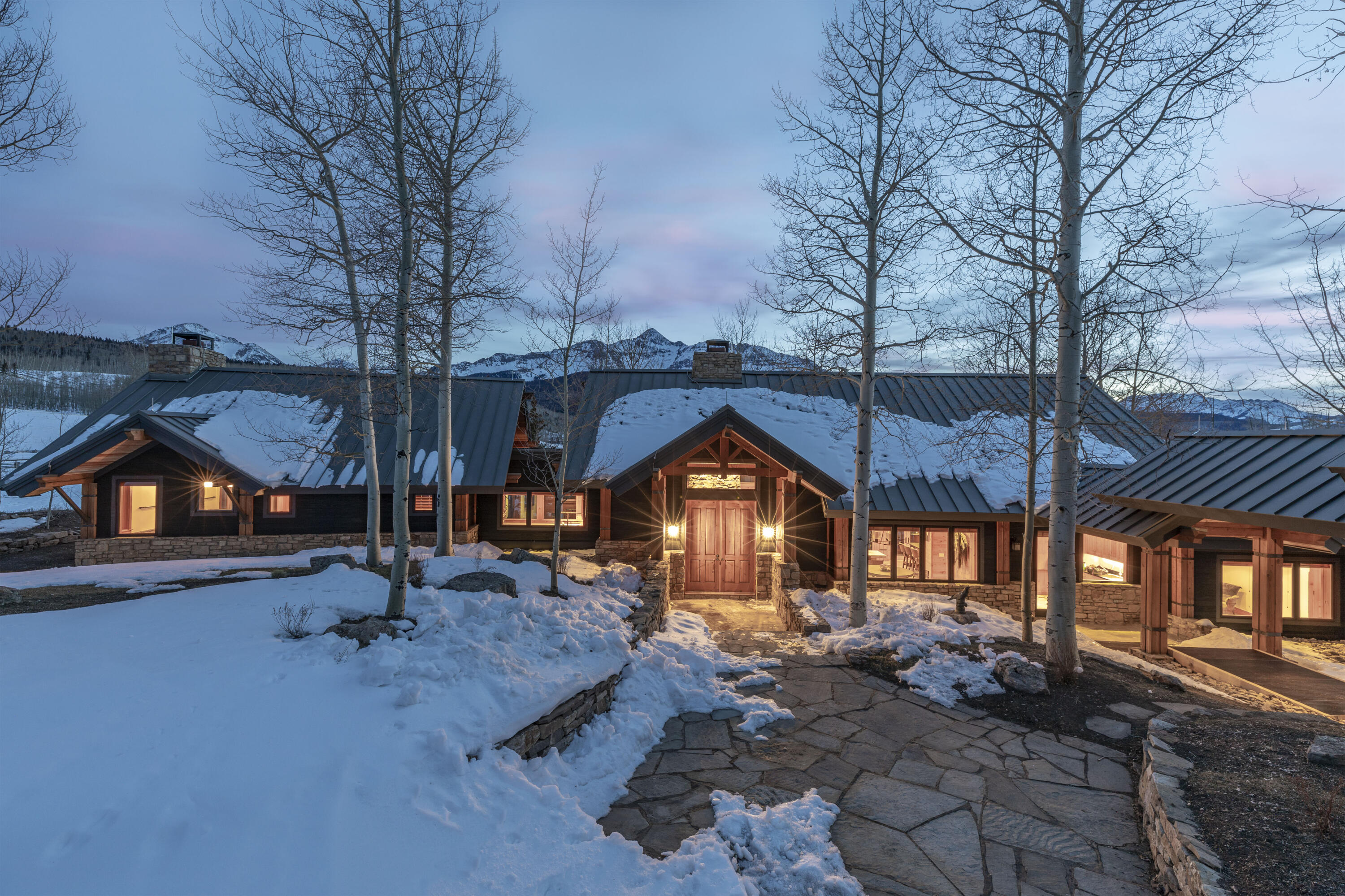 6800 County Road Telluride, CO 81435 - Photo 62 of 64 a backyard of a house with barbeque oven table and chairs