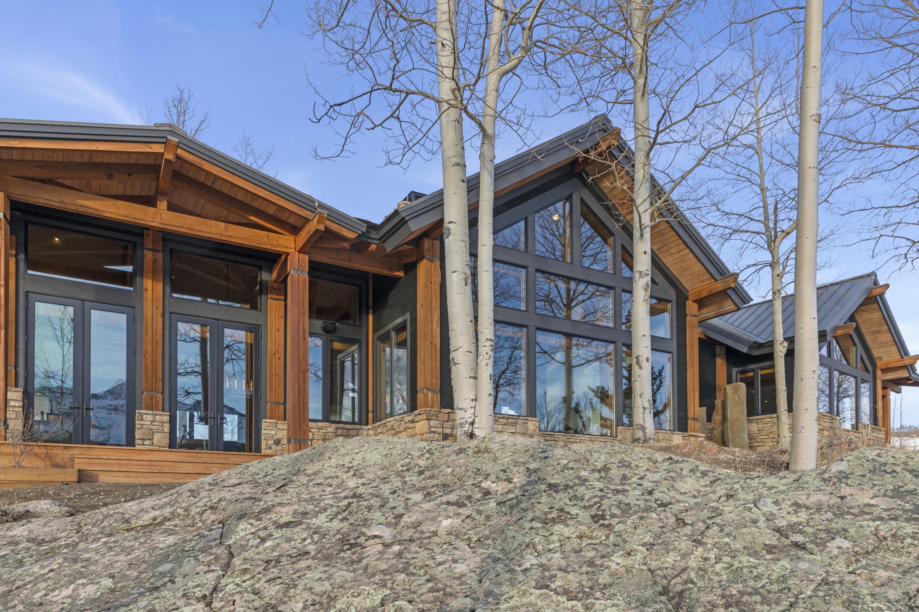 6800 County Road Telluride, CO 81435 - Photo 7 of 64 front view of a brick house with a large windows