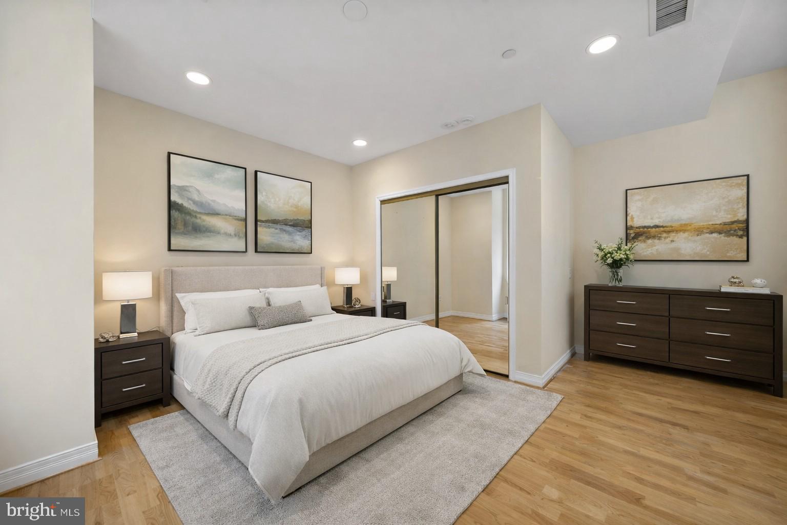 1600 Arch Street, Unit 1116 Philadelphia, PA 19103 - Photo 11 of 23 a bedroom with a bed and a painting on the wall