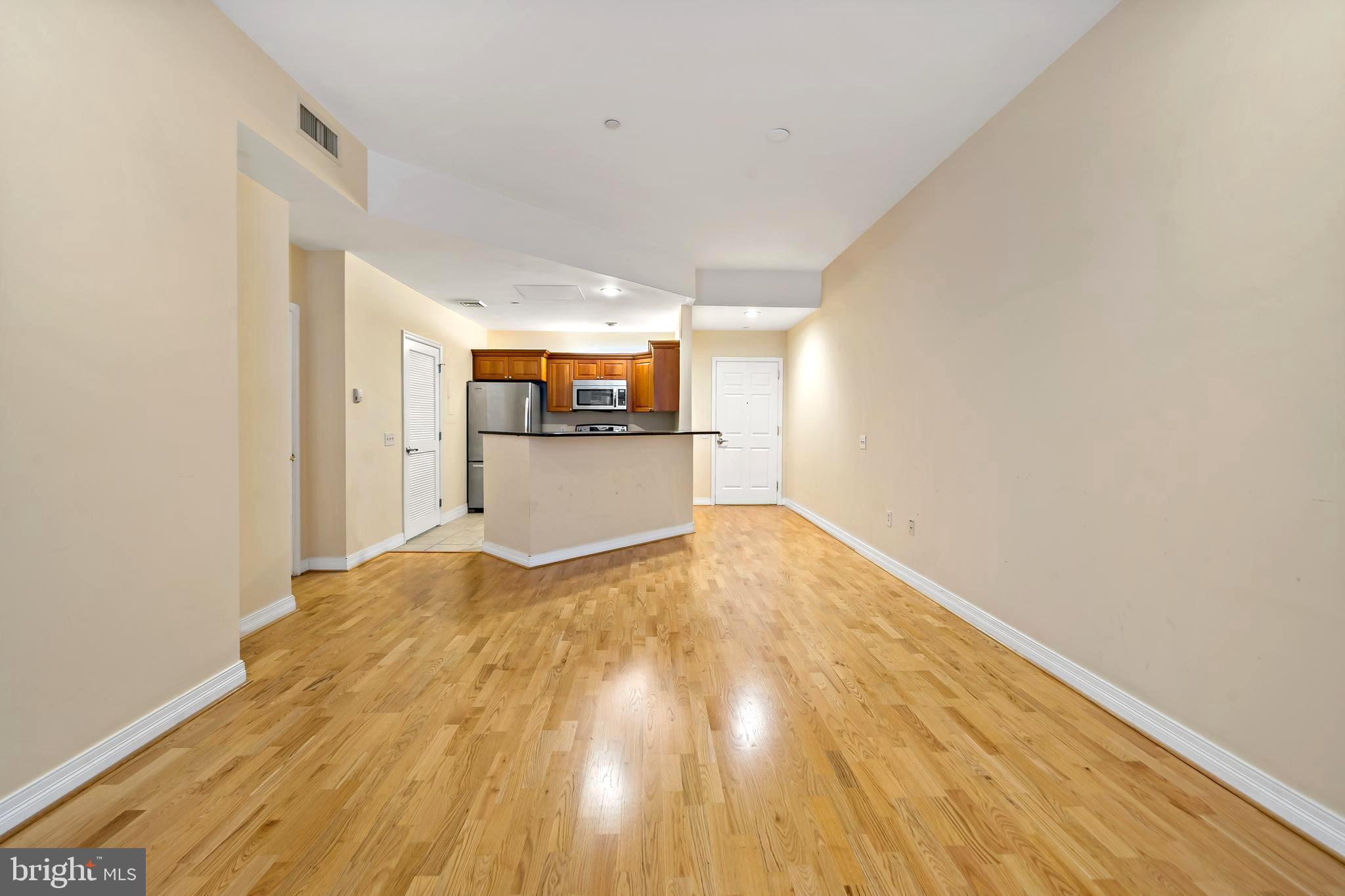 1600 Arch Street, Unit 1116 Philadelphia, PA 19103 - Photo 8 of 23 a view of empty room with wooden floor