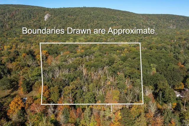 a view of a sign board with mountain view