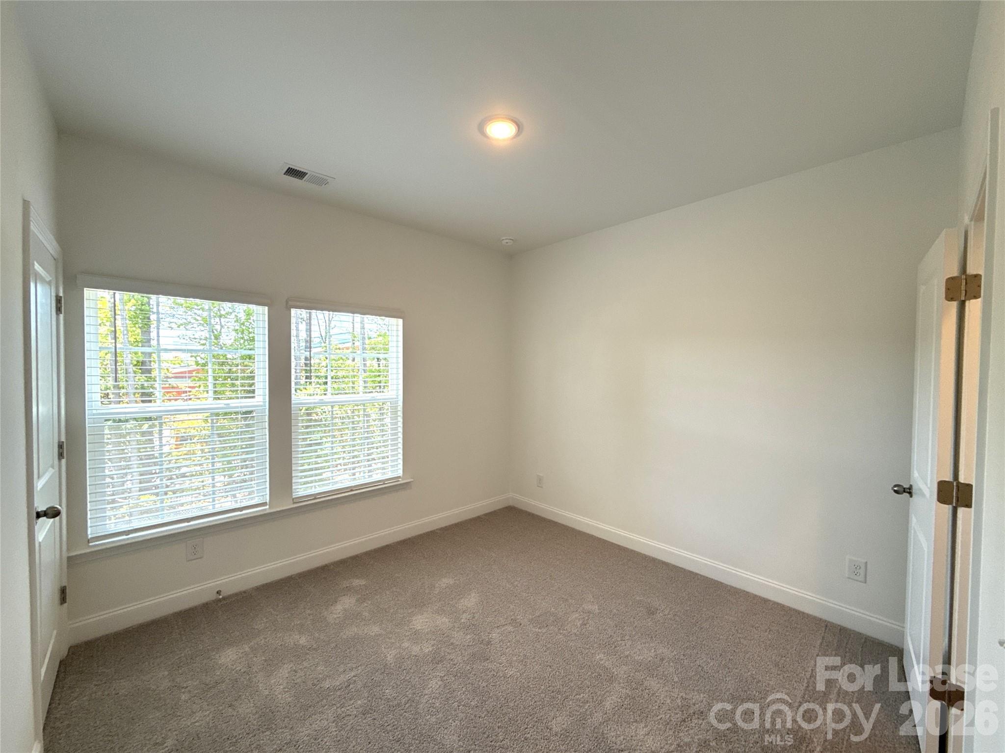 3220 Butler Hl Drive Matthews, NC 28105 - Photo 7 of 11 an empty room with a window