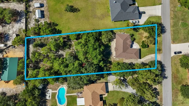 a view of a yard with a lake view