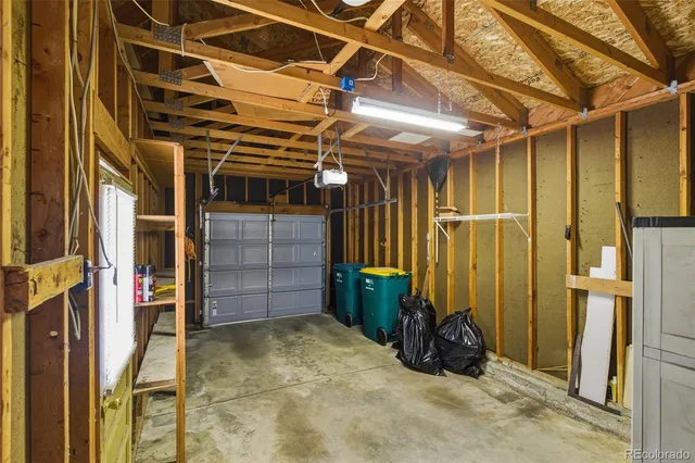 a view of walk in closet with clothes