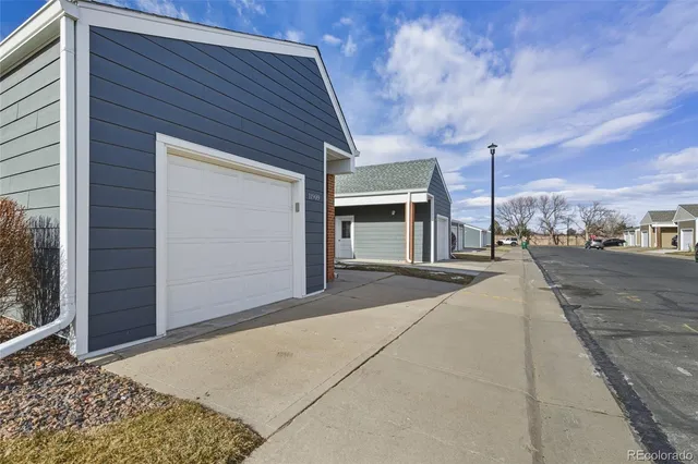 a view of a house with a street