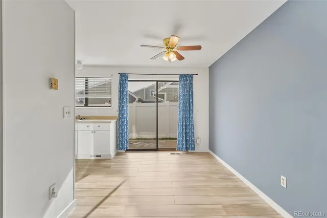a view of a kitchen with a sink and cabinets