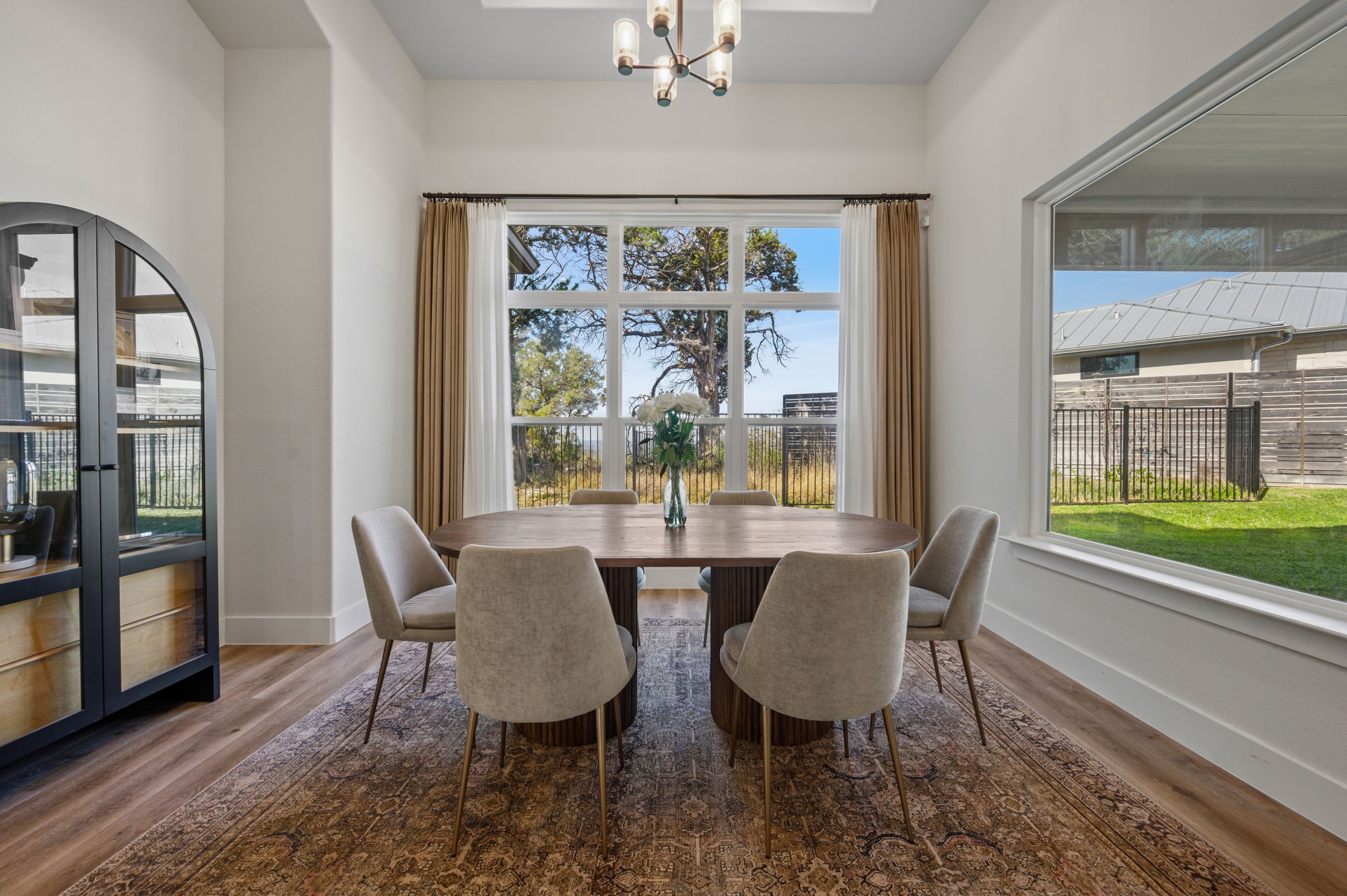 8604 Bar K Ranch Road Lago Vista, TX 78645 - Photo 11 of 37 Dining space with suspended lighting and dark wood-type flooring