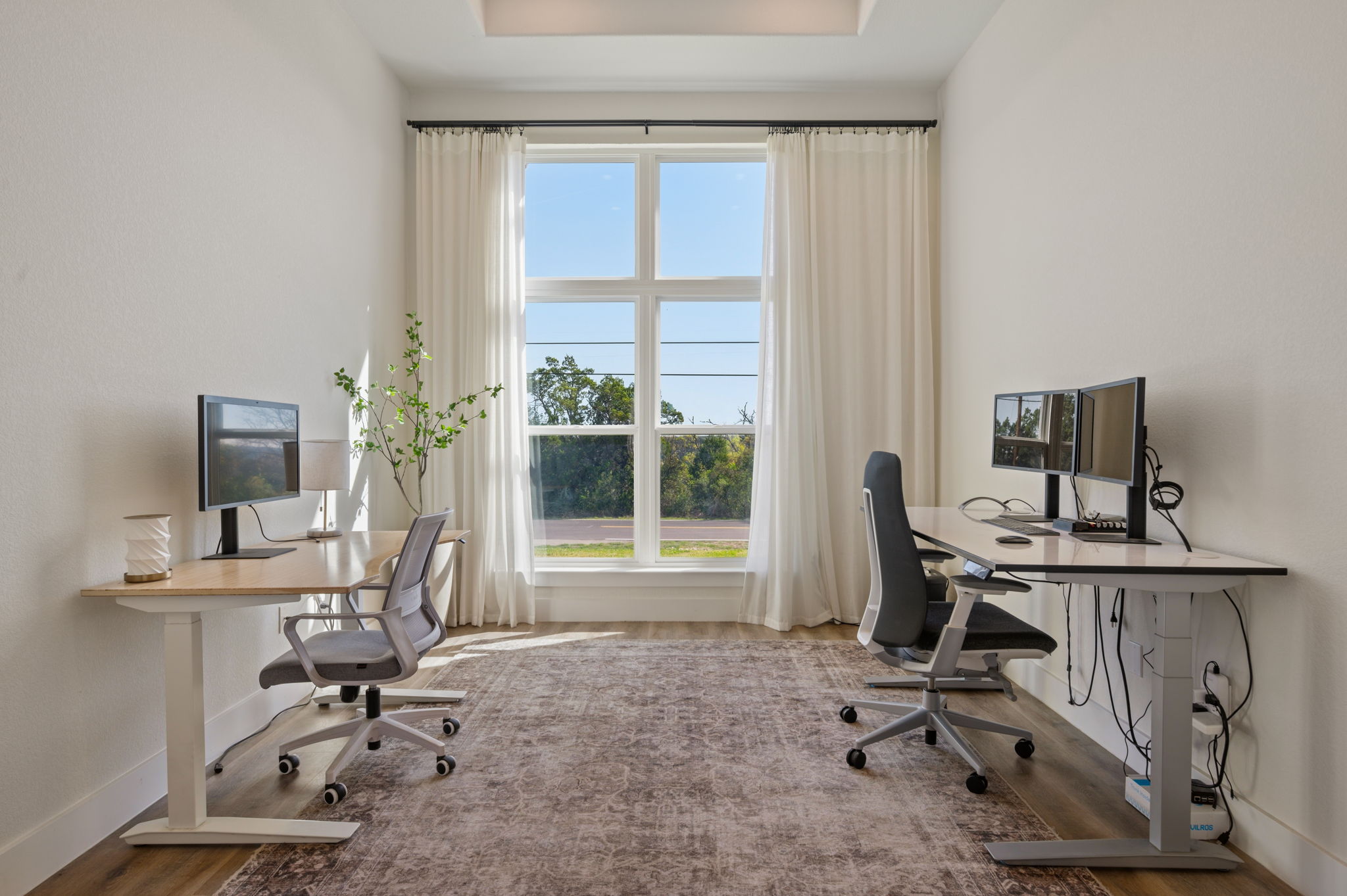 8604 Bar K Ranch Road Lago Vista, TX 78645 - Photo 20 of 37 Office area with a raised ceiling and wood finished floors