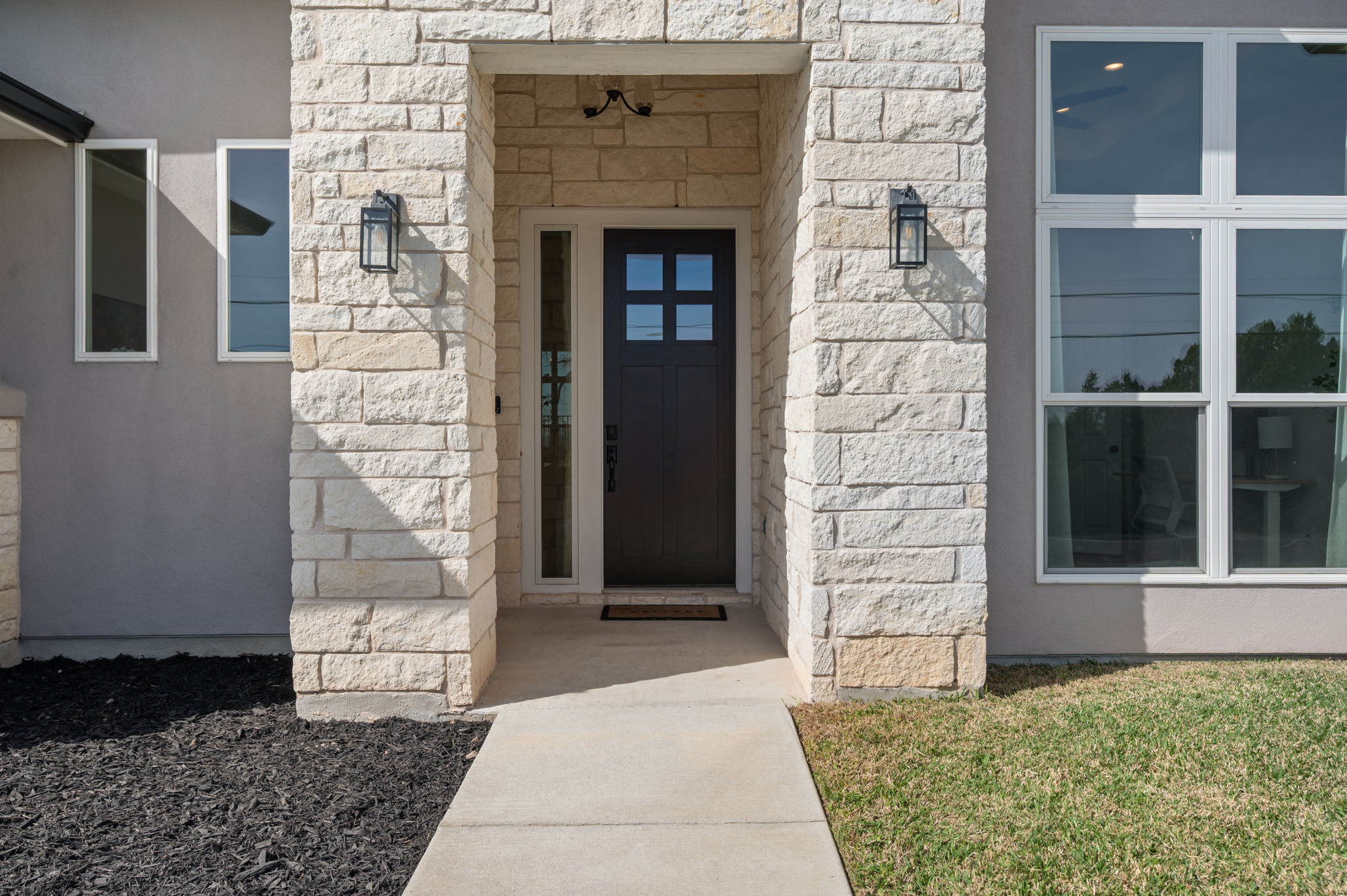 8604 Bar K Ranch Road Lago Vista, TX 78645 - Photo 2 of 37 Entrance to property with stone siding