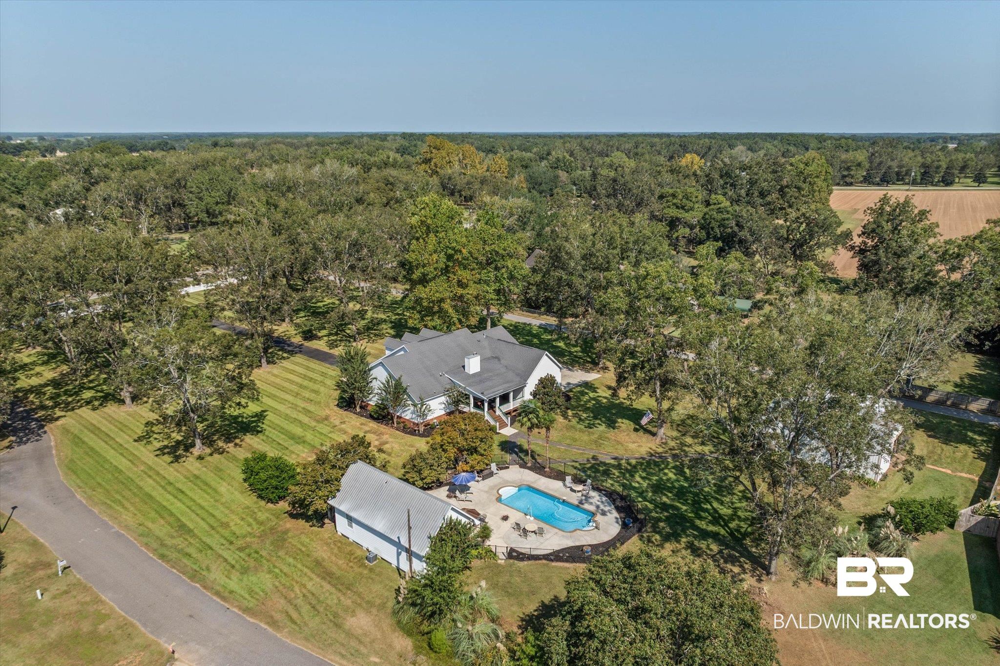 6175 South Grand Bay Wilmer Road Grand Bay, AL 36541 - Photo 36 of 42 Aerial overview of property's location with a pool and a heavily wooded area