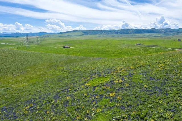 a view of an ocean and a yard