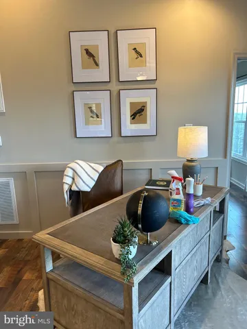 a living room with furniture and a lamp