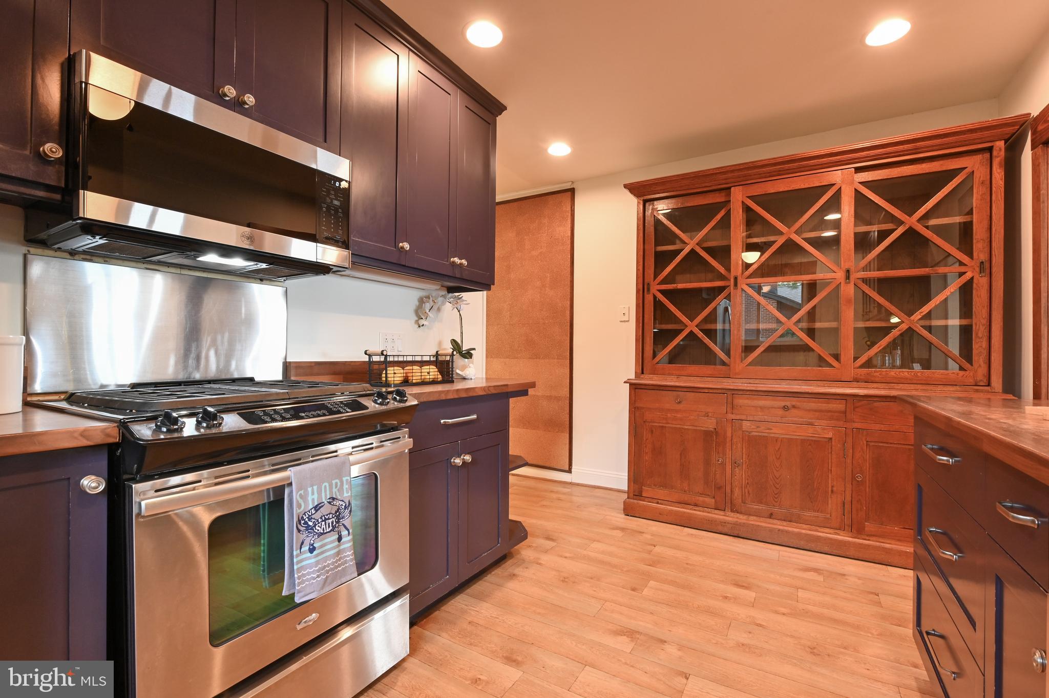 769 Robin Hood Road Annapolis, MD 21405 - Photo 15 of 79 a kitchen with stainless steel appliances granite countertop a stove and a microwave