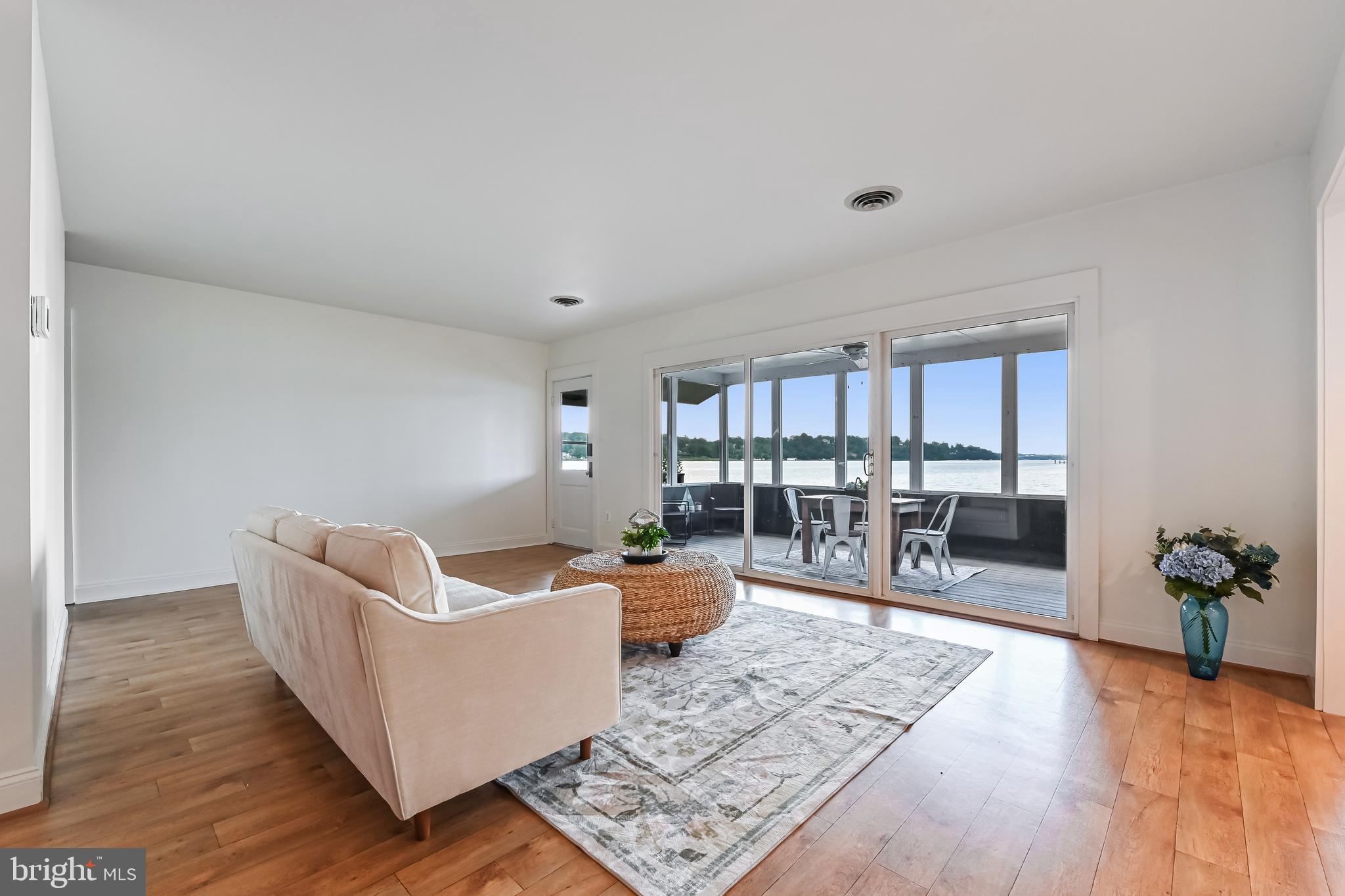 769 Robin Hood Road Annapolis, MD 21405 - Photo 25 of 79 a living room with furniture and a wooden floor