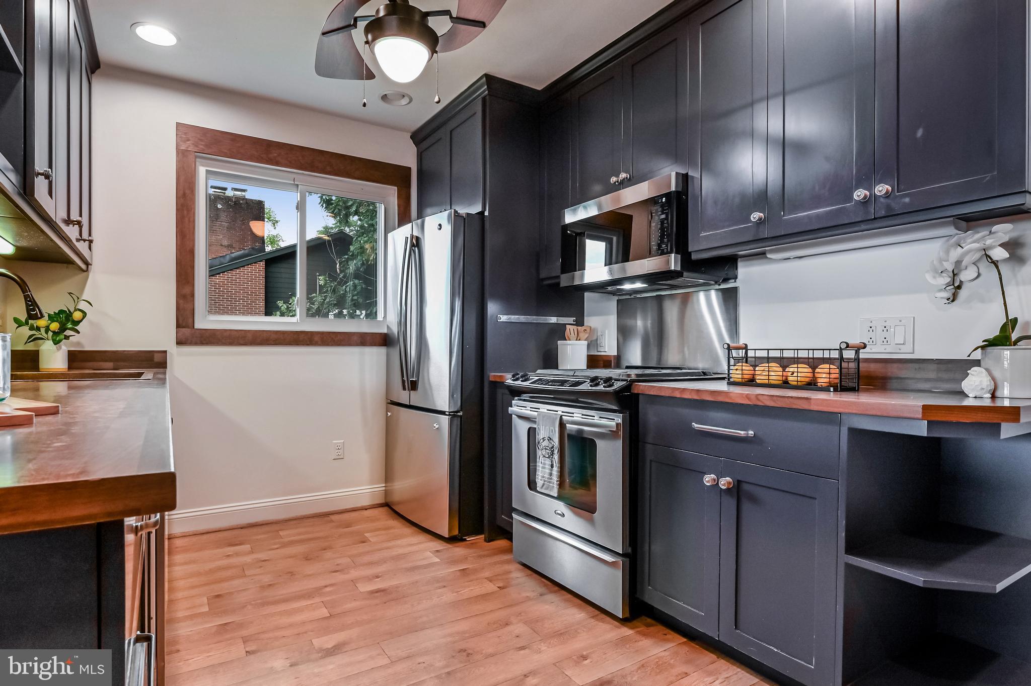 769 Robin Hood Road Annapolis, MD 21405 - Photo 28 of 79 a kitchen with stainless steel appliances granite countertop a refrigerator a sink and a stove