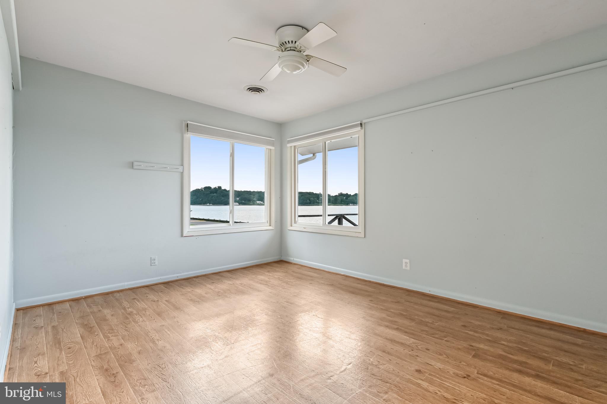 769 Robin Hood Road Annapolis, MD 21405 - Photo 36 of 79 a view of empty room with wooden floor and fan