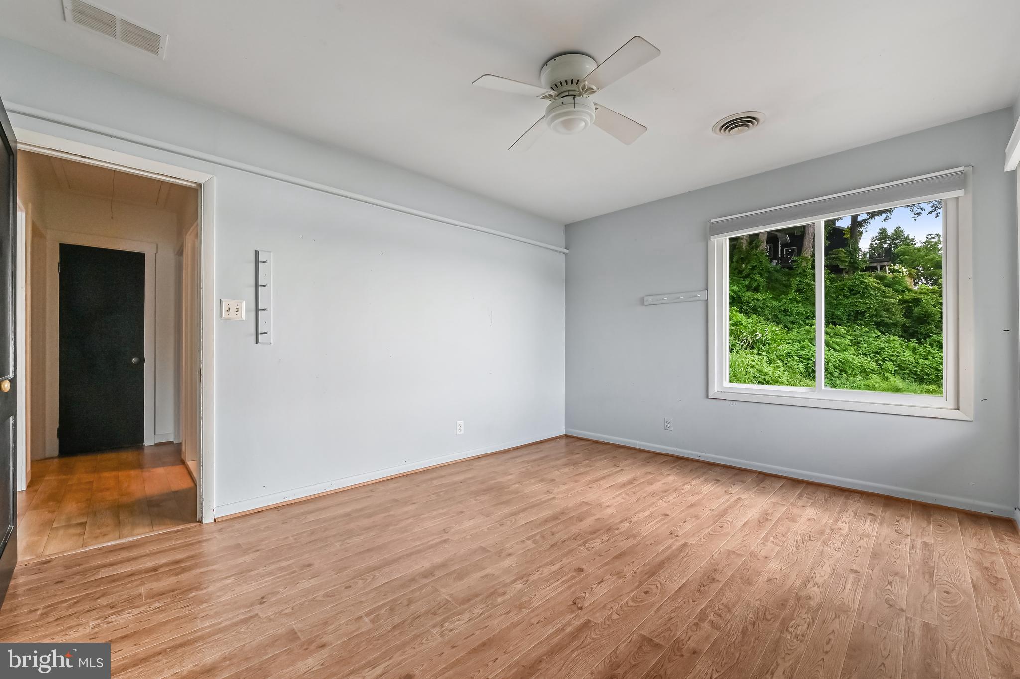 769 Robin Hood Road Annapolis, MD 21405 - Photo 37 of 79 a view of empty room with wooden floor and fan