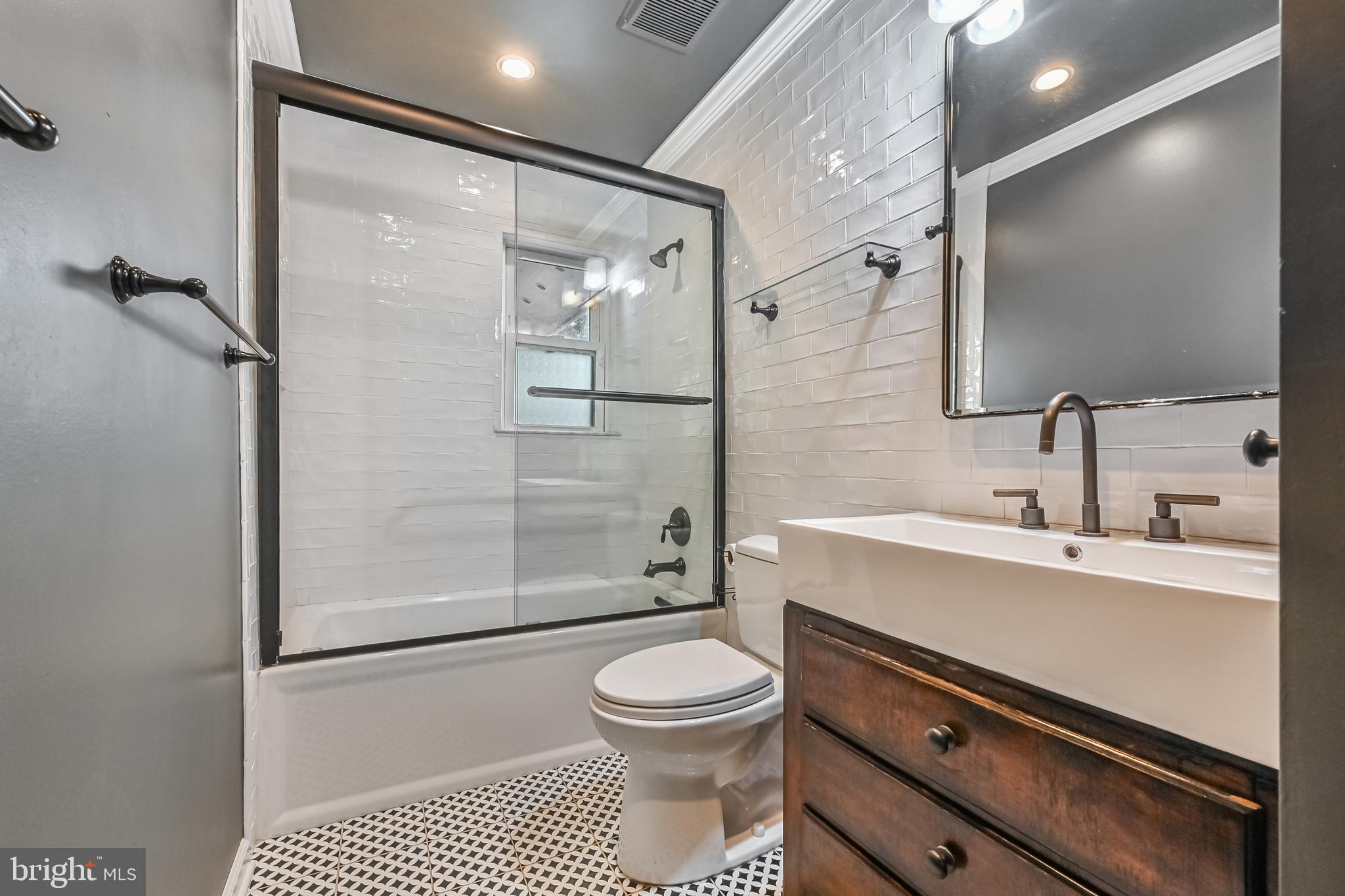 769 Robin Hood Road Annapolis, MD 21405 - Photo 38 of 79 a bathroom with a sink a toilet and shower