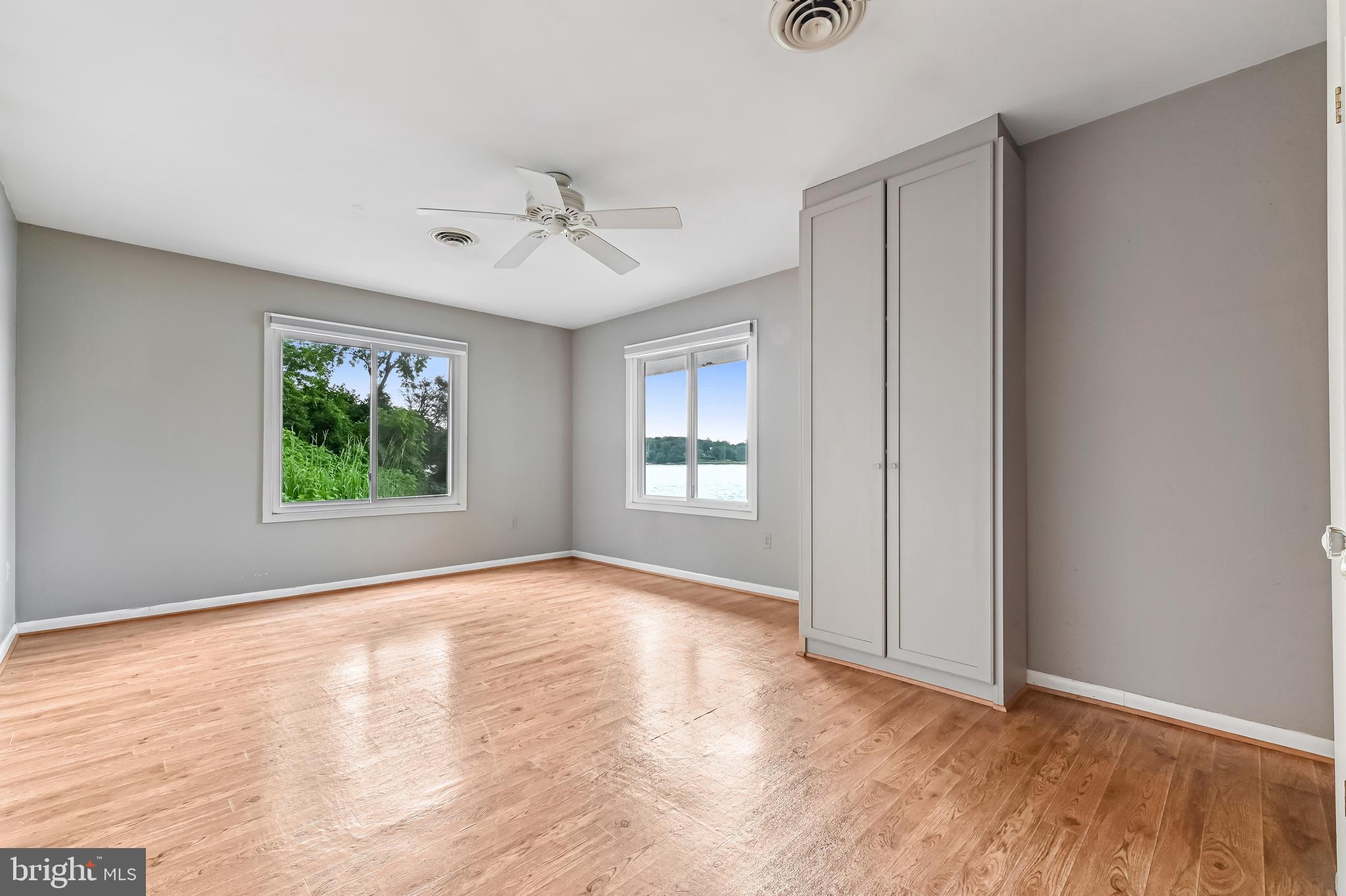 769 Robin Hood Road Annapolis, MD 21405 - Photo 40 of 79 a view of an empty room with a window and wooden floor
