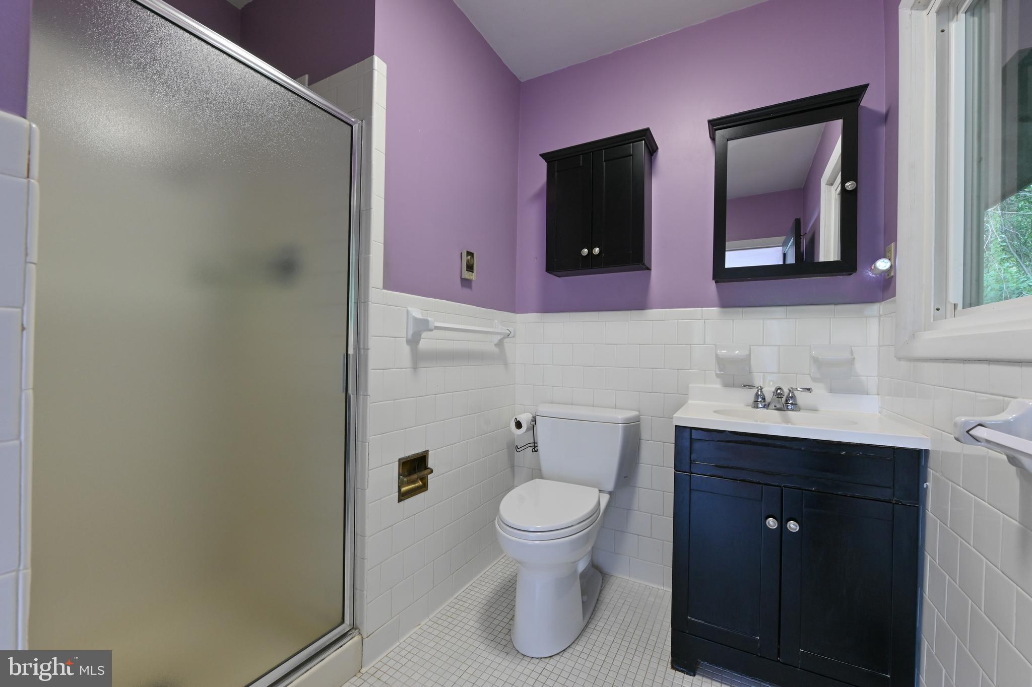 769 Robin Hood Road Annapolis, MD 21405 - Photo 41 of 79 a bathroom with a toilet a sink a vanity and mirror