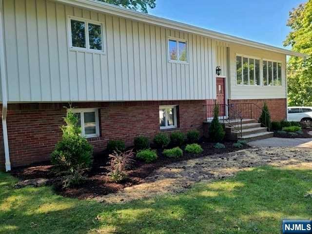 32 Rock Road Englewood Cliffs, NJ 07632 - Photo 3 of 30 a view of a house with a backyard