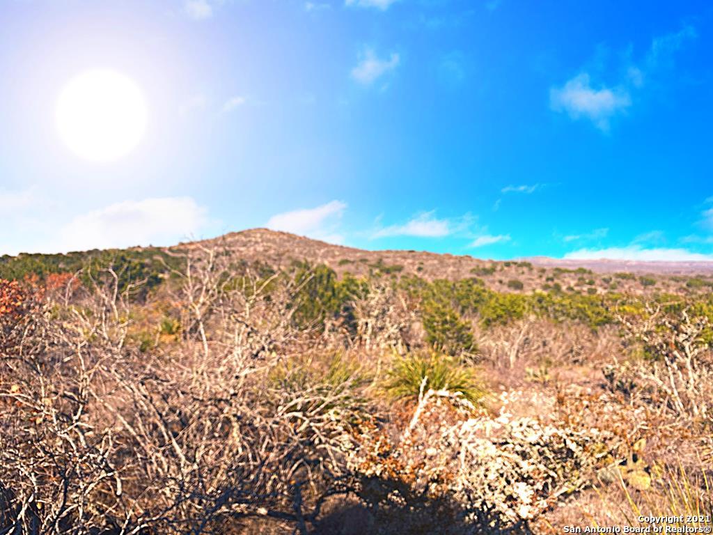 a view of a large body of water and mountain