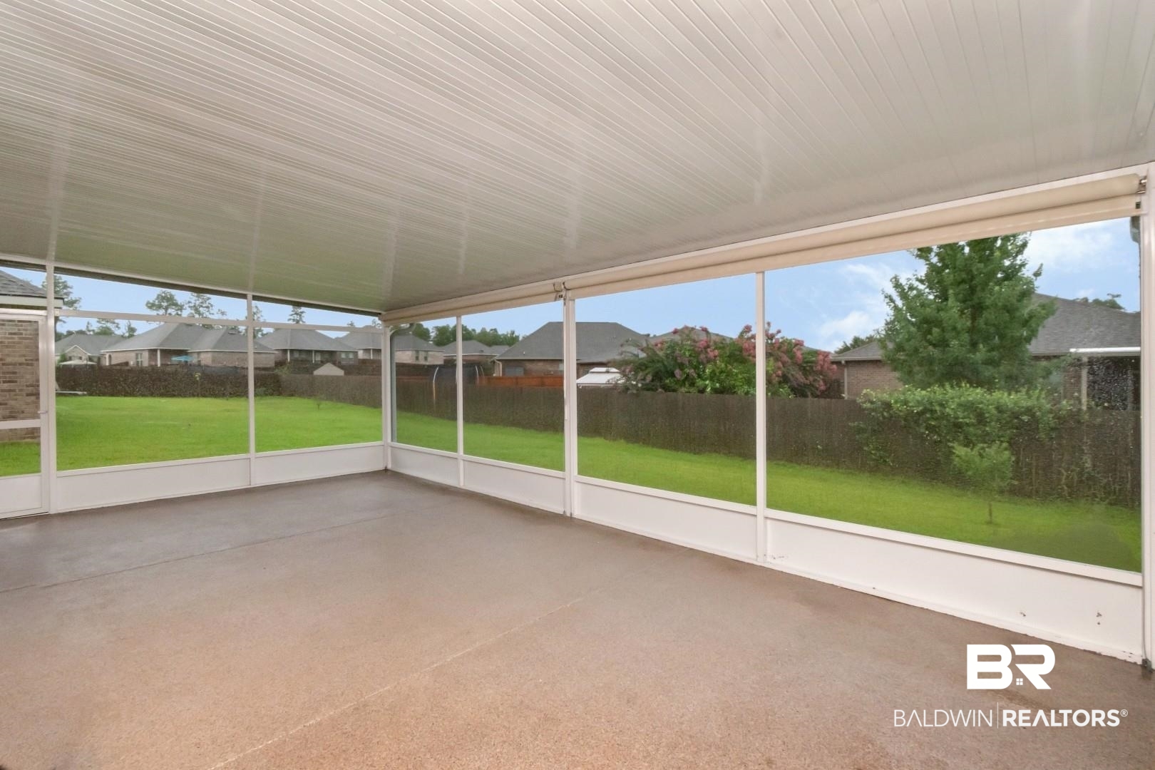 10714 Brodick Loop Spanish Fort, AL 36527 - Photo 23 of 26 Unfurnished sunroom featuring a residential view