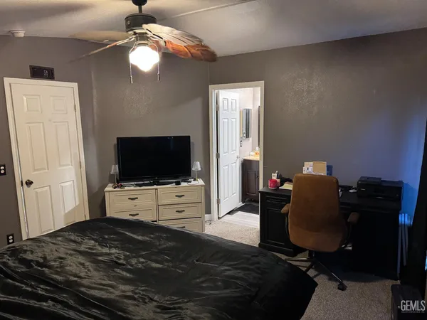 a bedroom with a bed and furniture