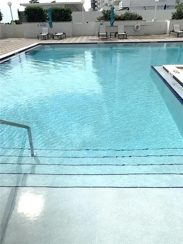a kitchen with a sink appliances and cabinets