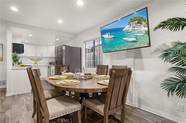 a kitchen with stainless steel appliances granite countertop a sink a stove and a cabinets