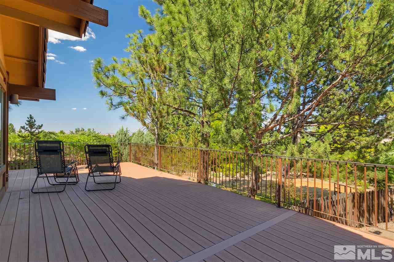 12935 Roseview Lane Reno, NV 89511 - Photo 17 of 17 a view of a patio with table and chairs and wooden floor