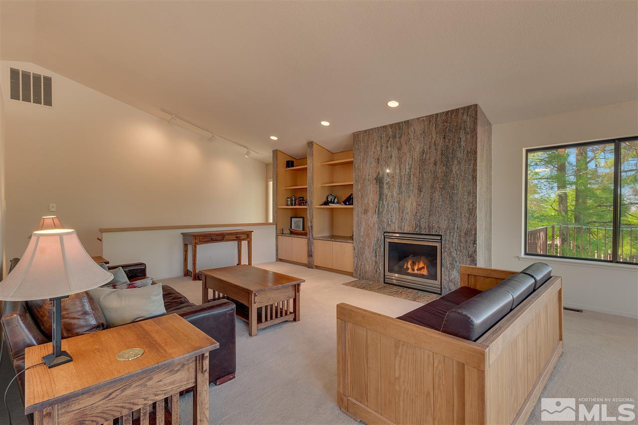 12935 Roseview Lane Reno, NV 89511 - Photo 3 of 17 a living room with furniture and a fireplace