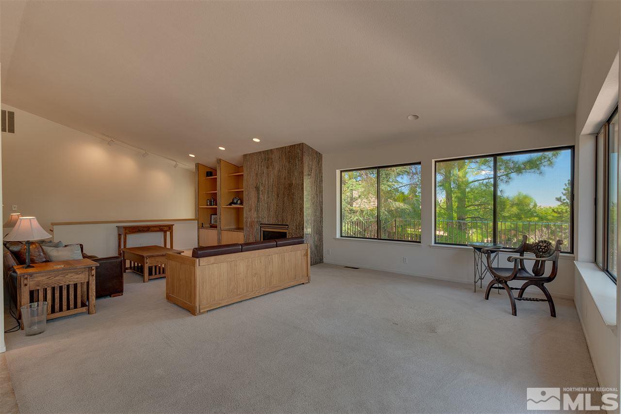 12935 Roseview Lane Reno, NV 89511 - Photo 4 of 17 a living room with furniture and a flat screen tv