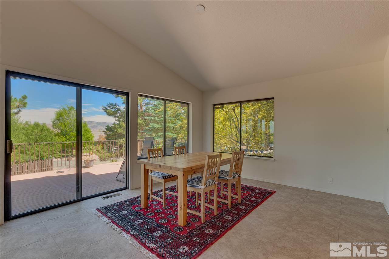 12935 Roseview Lane Reno, NV 89511 - Photo 9 of 17 a view of a dining room with furniture window and outside view