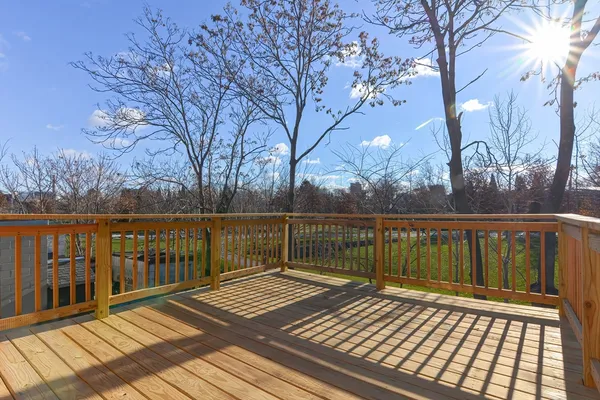 a view of wooden deck with a patio