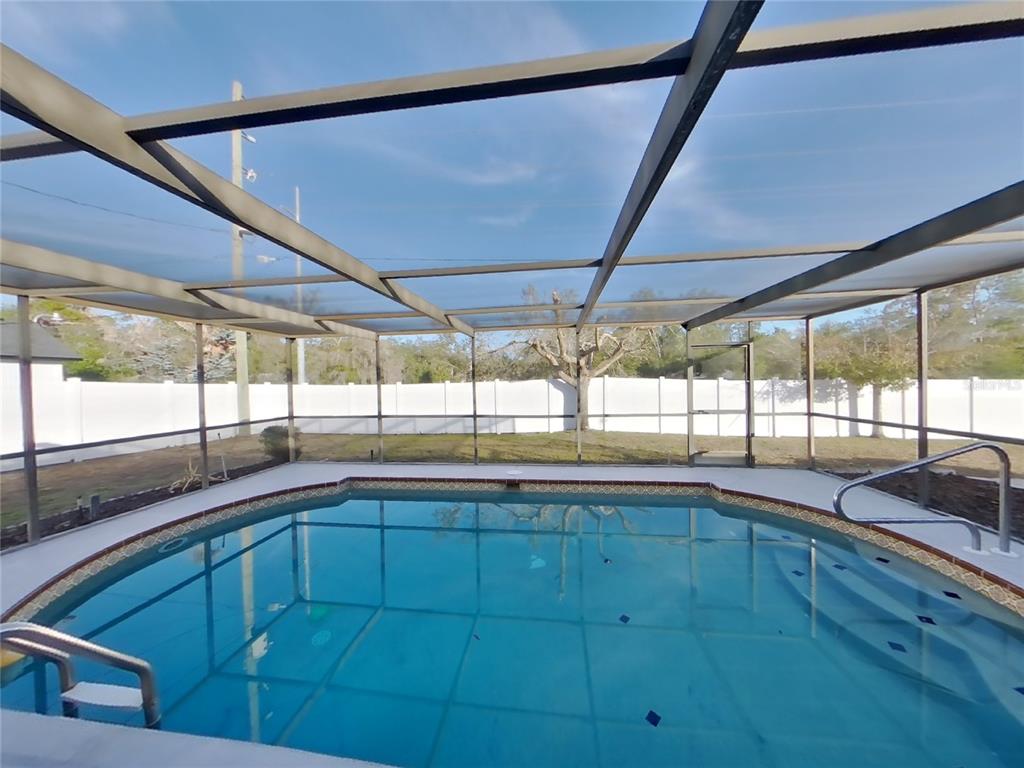 Undisclosed Address Spring Hill, FL 34608 - Photo 12 of 16 a view of a kitchen with a sink and large window