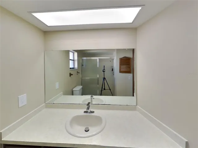 a bathroom with a sink and a mirror