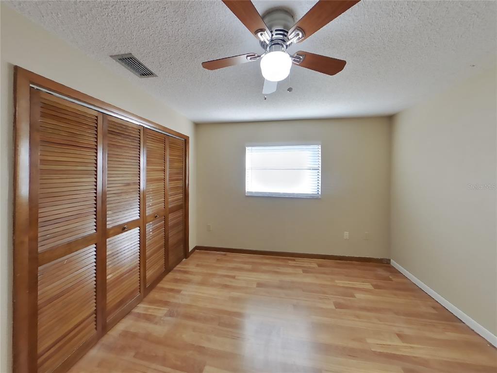 Undisclosed Address Spring Hill, FL 34608 - Photo 8 of 16 a view of an empty room with a window