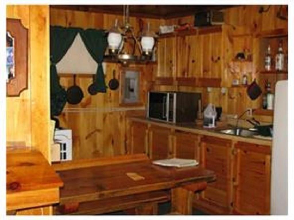 222 Mattamiscontis Road Howland, ME 04448 - Photo 6 of 15 The off grid cabin has plenty of...