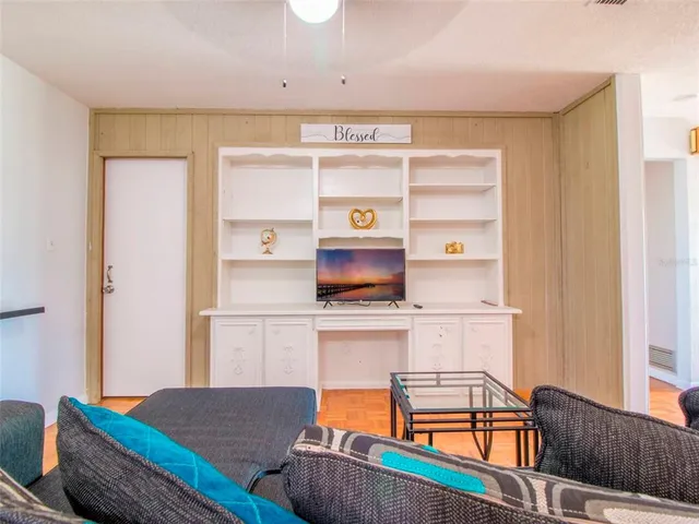 a living room with furniture and a table