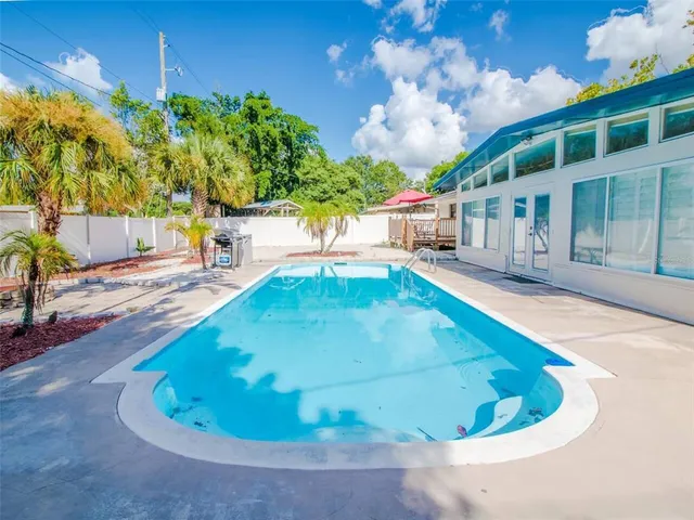 a view of a house with a swimming pool