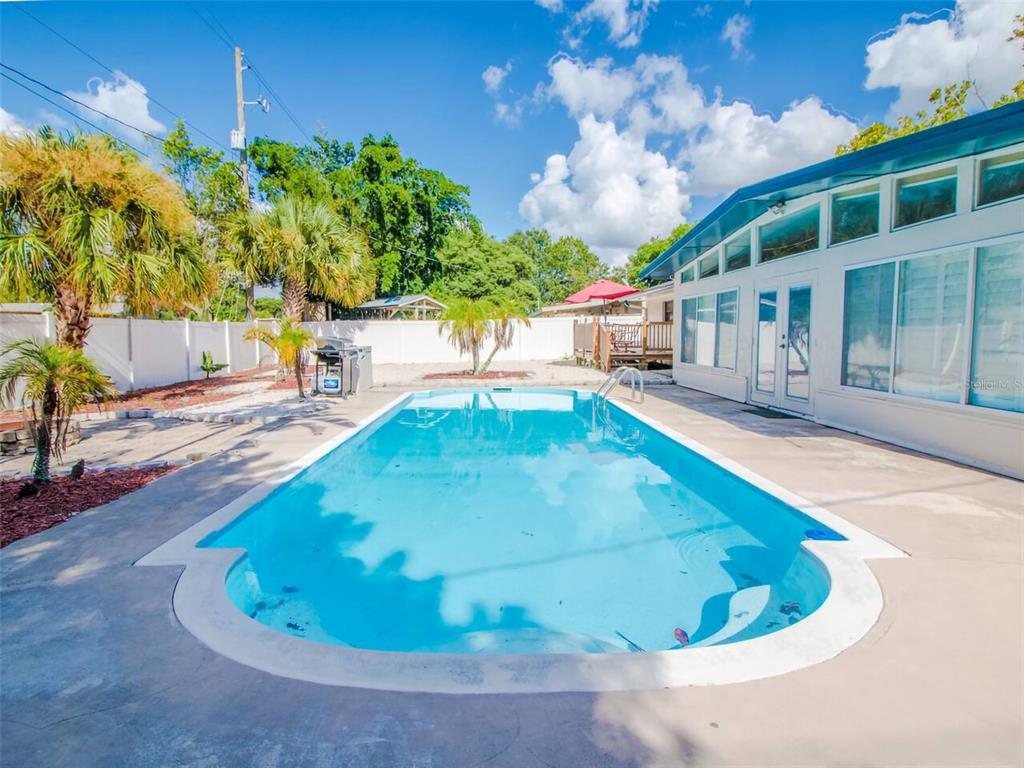 Undisclosed Address Orlando, FL 32812 - Photo 23 of 26 a view of a house with a swimming pool