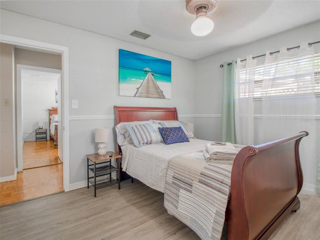 Undisclosed Address Orlando, FL 32812 - Photo 10 of 26 a bedroom with a bed and a window