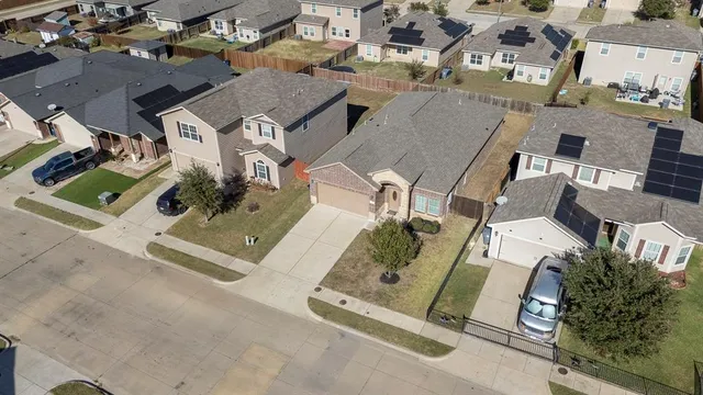 an aerial view of residential house with parking