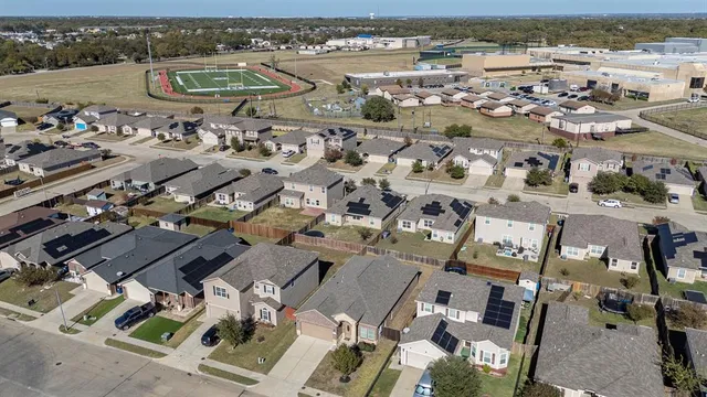 an aerial view of a city with ocean view