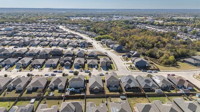 an aerial view of a building with an outdoor space