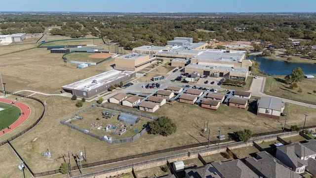 an aerial view of a building with outdoor space