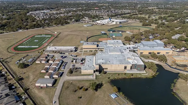 an aerial view of residential houses with outdoor space